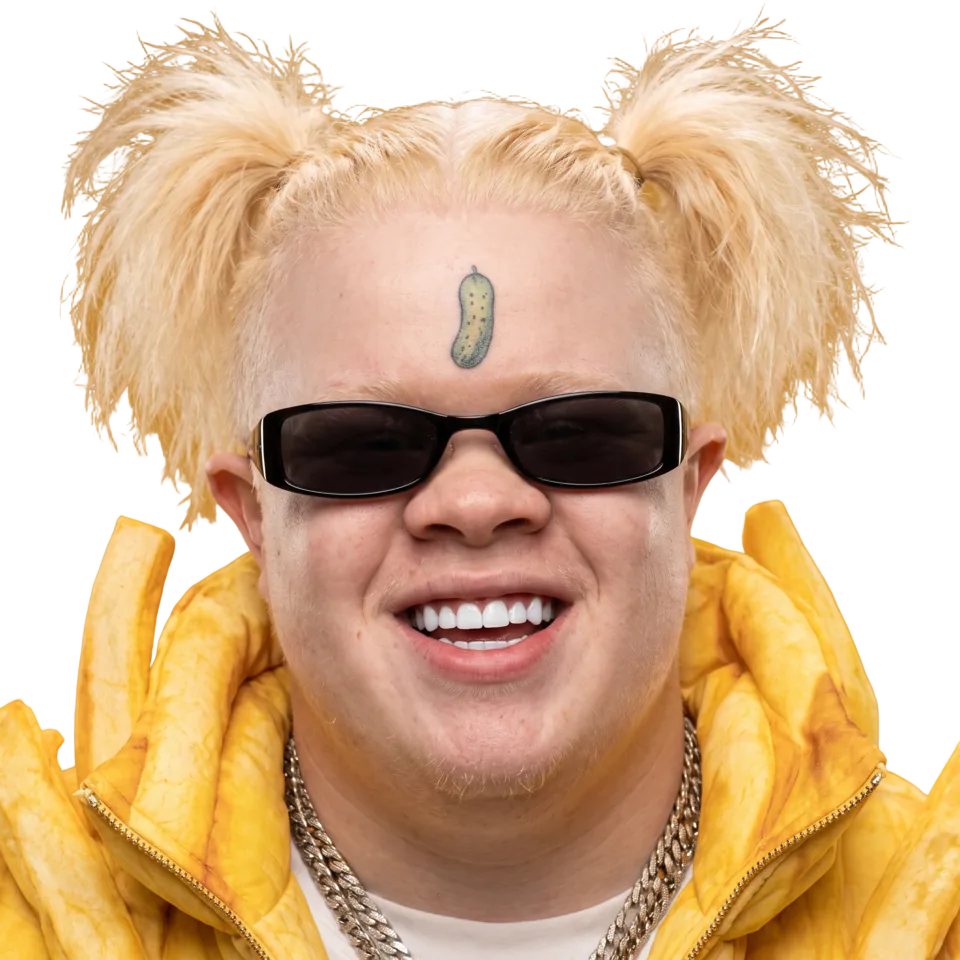 Fries McGee grinning in black shades, pickle tattoo on his forehead